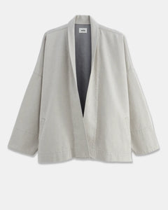 Veste ample en coton léger de couleur granit non teint, avec un col châle et des manches larges, parfaite pour une silhouette décontractée et confortable.