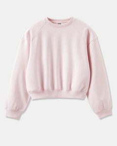 sweat-shirt rose clair en coton doux, coupe ample avec manches longues raglan et bords-côtes aux poignets et à la taille pour un style confortable et décontracté