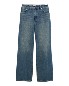 Jean pour femme en denim 100% coton, couleur indigo délavée, coupe large et droite offrant un style décontracté et confortable adaptable à toutes les morphologies.