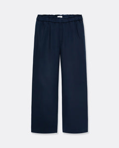 Pantalon large en tissu fluide bleu marine, coupe décontractée avec taille élastiquée, idéal pour un style confortable et élégant femme.