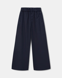 Pantalon large en popeline bleu marine, coupe ample et fluide avec taille élastiquée, matière légère idéale pour l'été, style décontracté et féminin.
